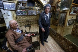 Northern Iraq cafe paints history in wall-to-wall photos