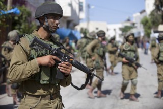 Israel tightens West Bank grip as Abbas blasts kidnappers