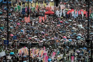 Tens of thousands march for democracy in H.K.