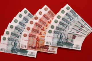 Western sanctions, ruble crash hit Russians hard