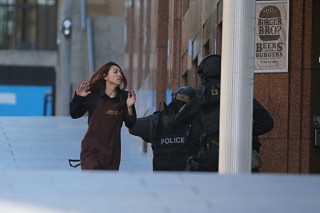 Five hostages run out of Sydney siege cafe