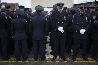 Thousands bid farewell to slain N.Y. cop