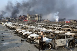 Firefighter rescued from blast zone in China’s Tianjin port