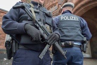 Brussels police conduct more raids linked to deadly bombings