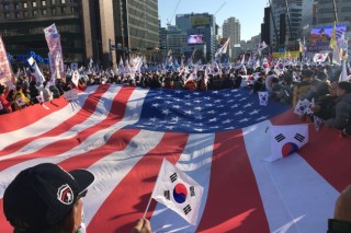 Why US flags at pro-Park rallies?