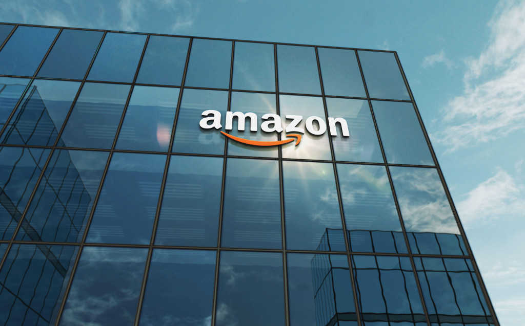 Seattle, USA, April 5, 2023: Amazon corporation headquarters glass building concept. International retail and shipping company symbol on front facade