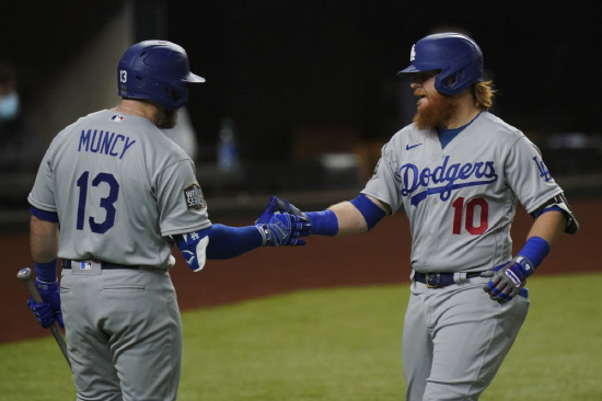 Turner celebrates his home run with Max Muncy