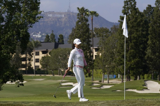 Jin Young Ko walks on the 13th green d