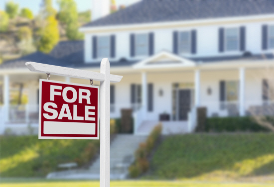 Home For Sale Sign in Front of New House