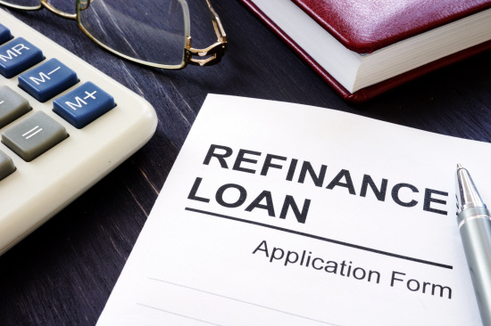 Refinance loan application form and pen.