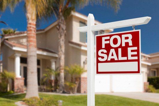 Home For Sale Sign in Front of New House