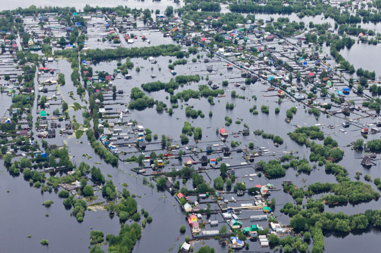 Flooded village in lowland of Great river