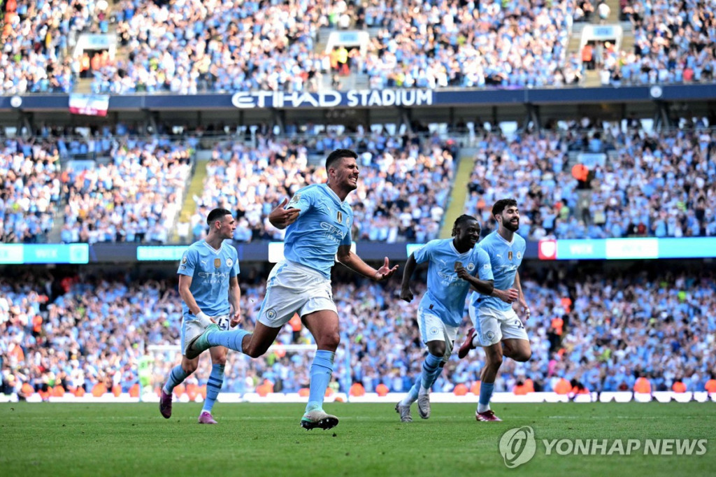 기뻐하는 맨시티 선수들 [AFP=연합]