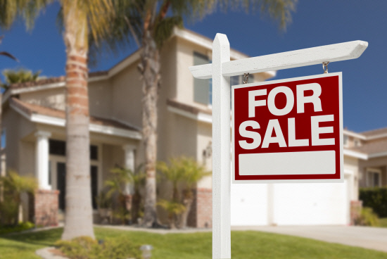 Home For Sale Sign in Front of New House