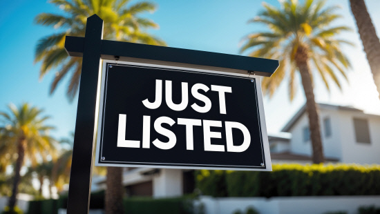 A black real estate sign featurin